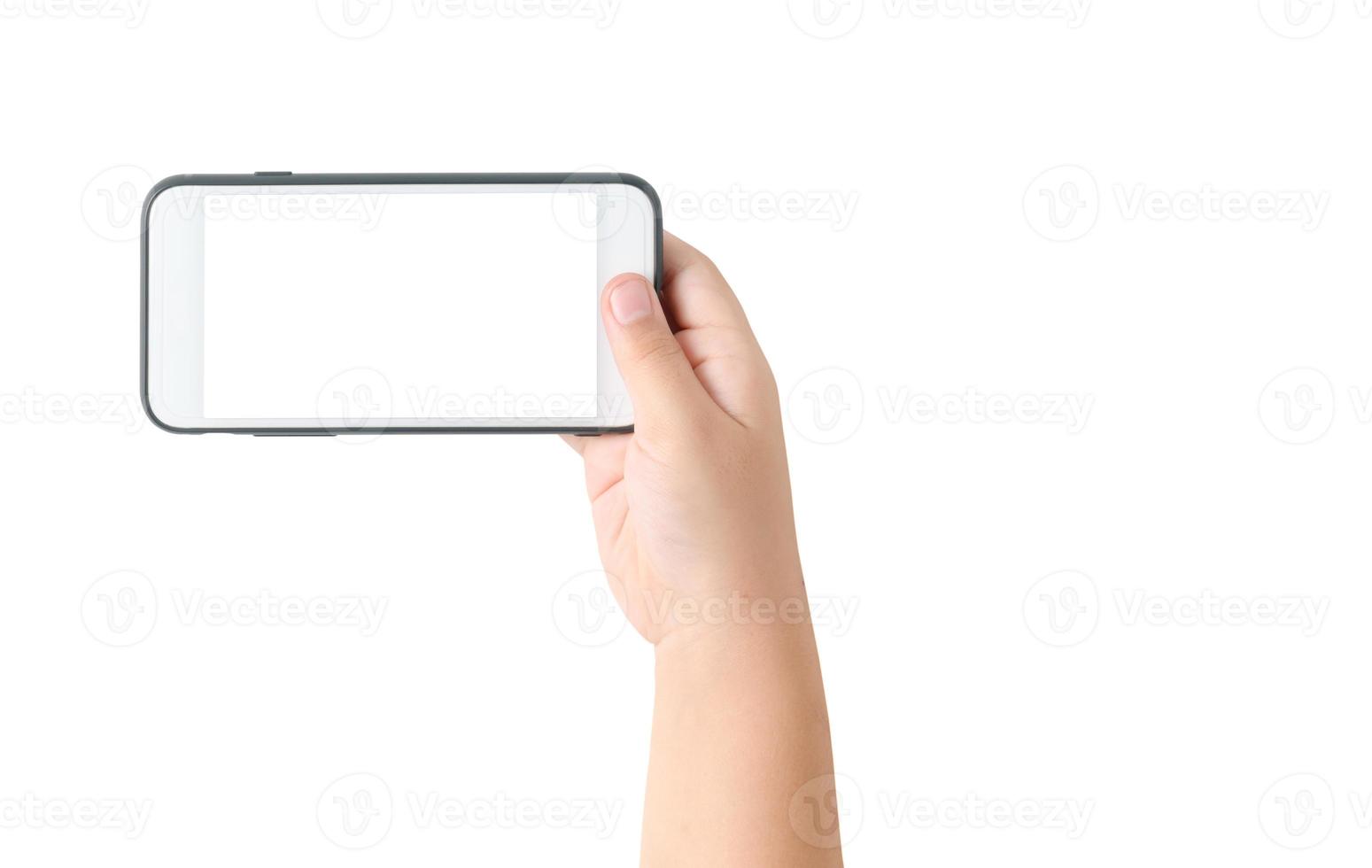 child hand hold mobile phone with blank white screen photo