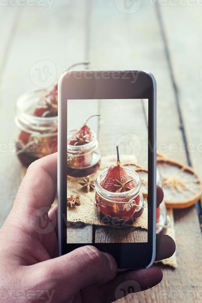 Pears and wine in the jar photo