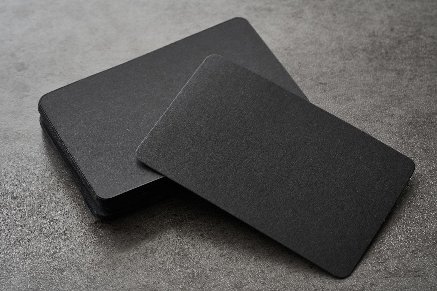 mock-up or blank Business card on black concrete background photo