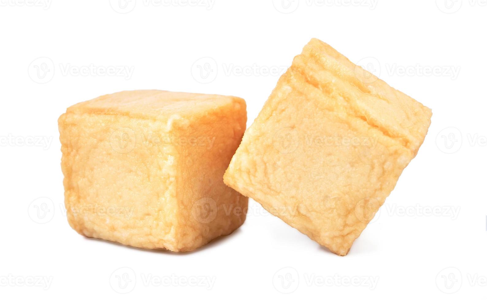 close-up of a pile of diced fish tofu isolated white background with clipping path photo