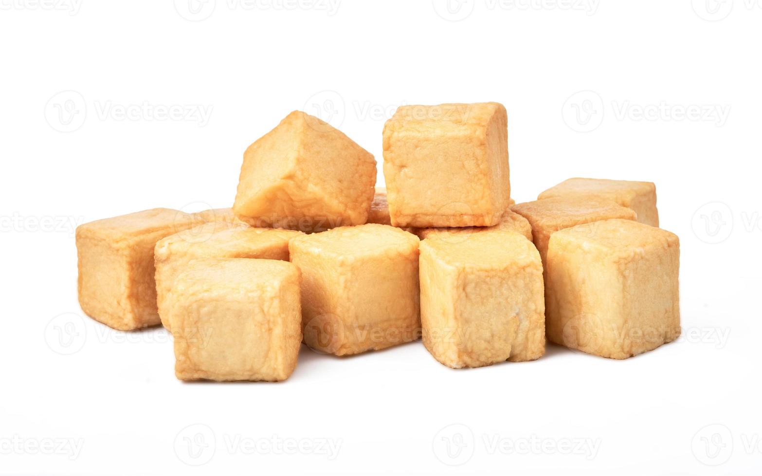 close-up of a pile of diced fish tofu isolated white background with clipping path photo