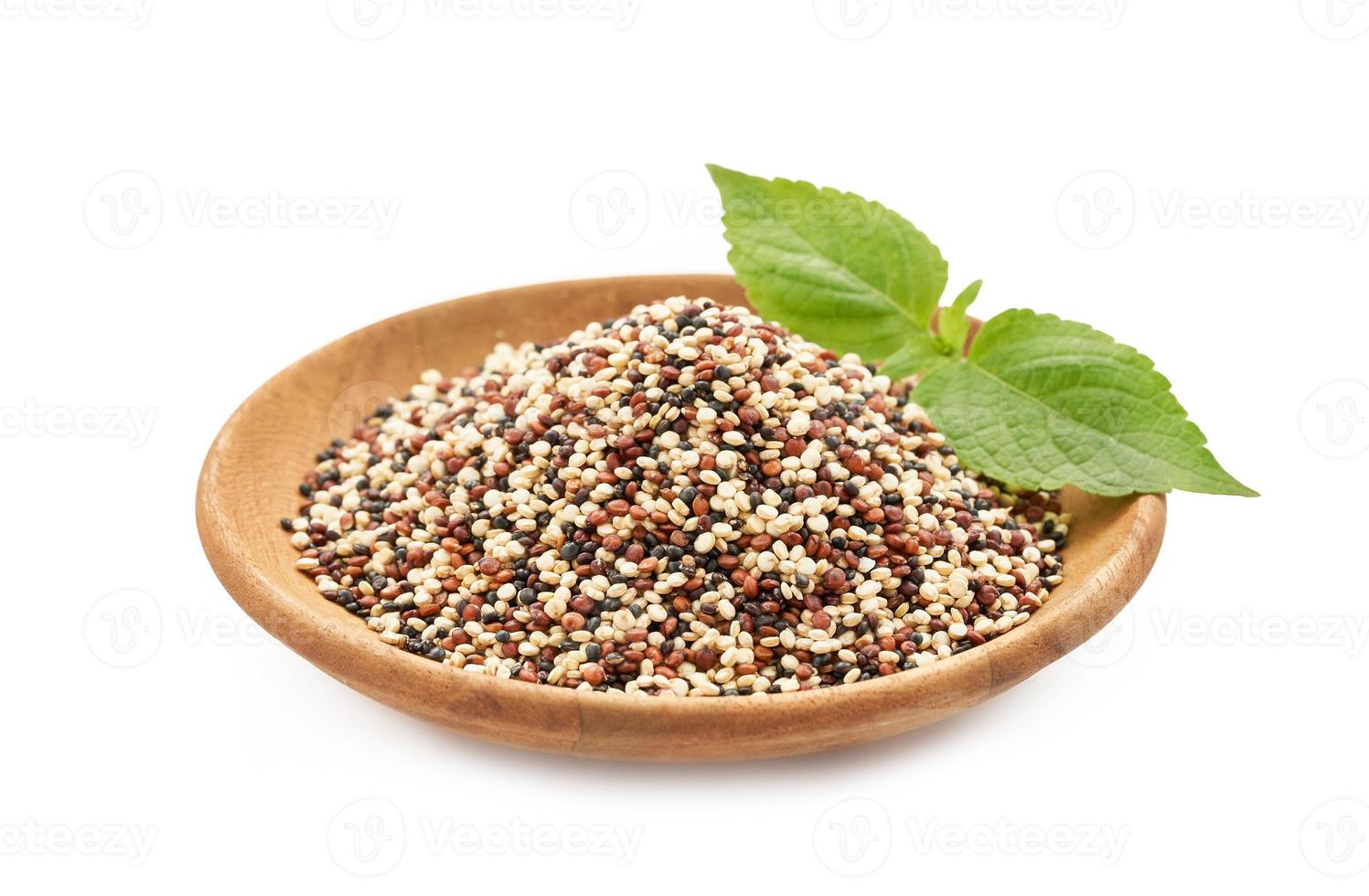 quinoa seeds in wooden bowl isolated on white background. close up quinoa seeds in wooden plate isolated on white background. quinoa seeds in spoon isolated photo