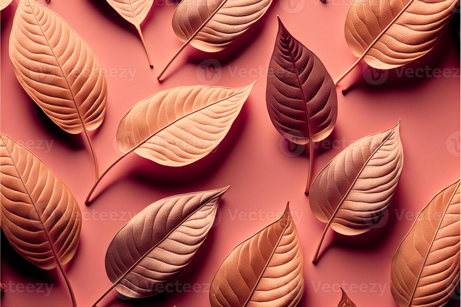 Pattern of dry orange metallic leaves on pink background. photo