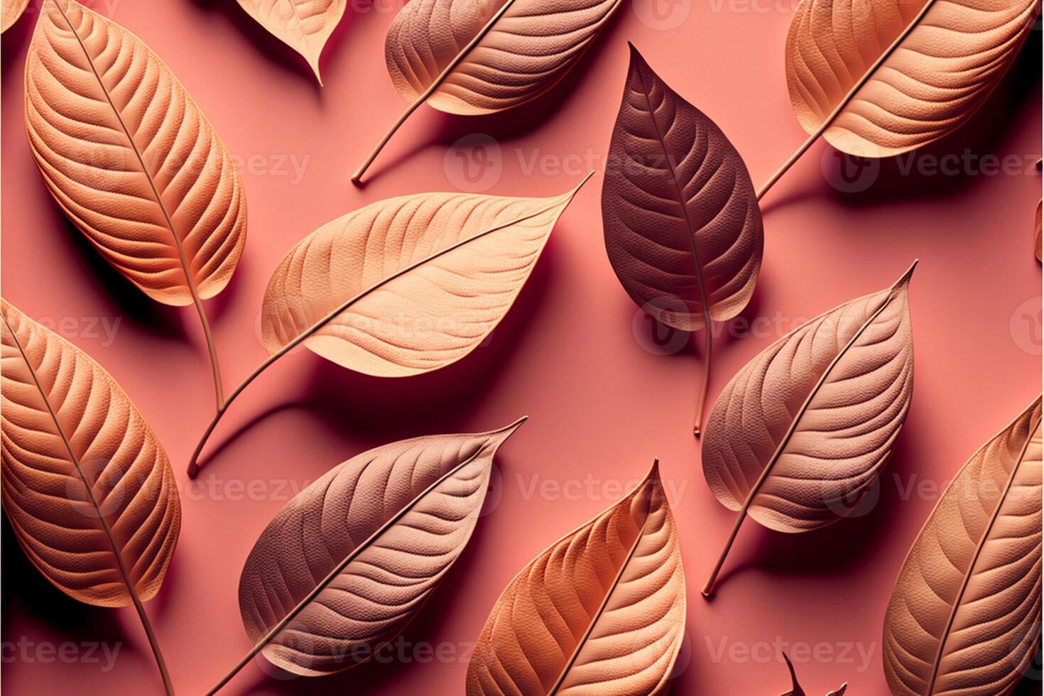 Pattern of dry orange metallic leaves on pink background. photo