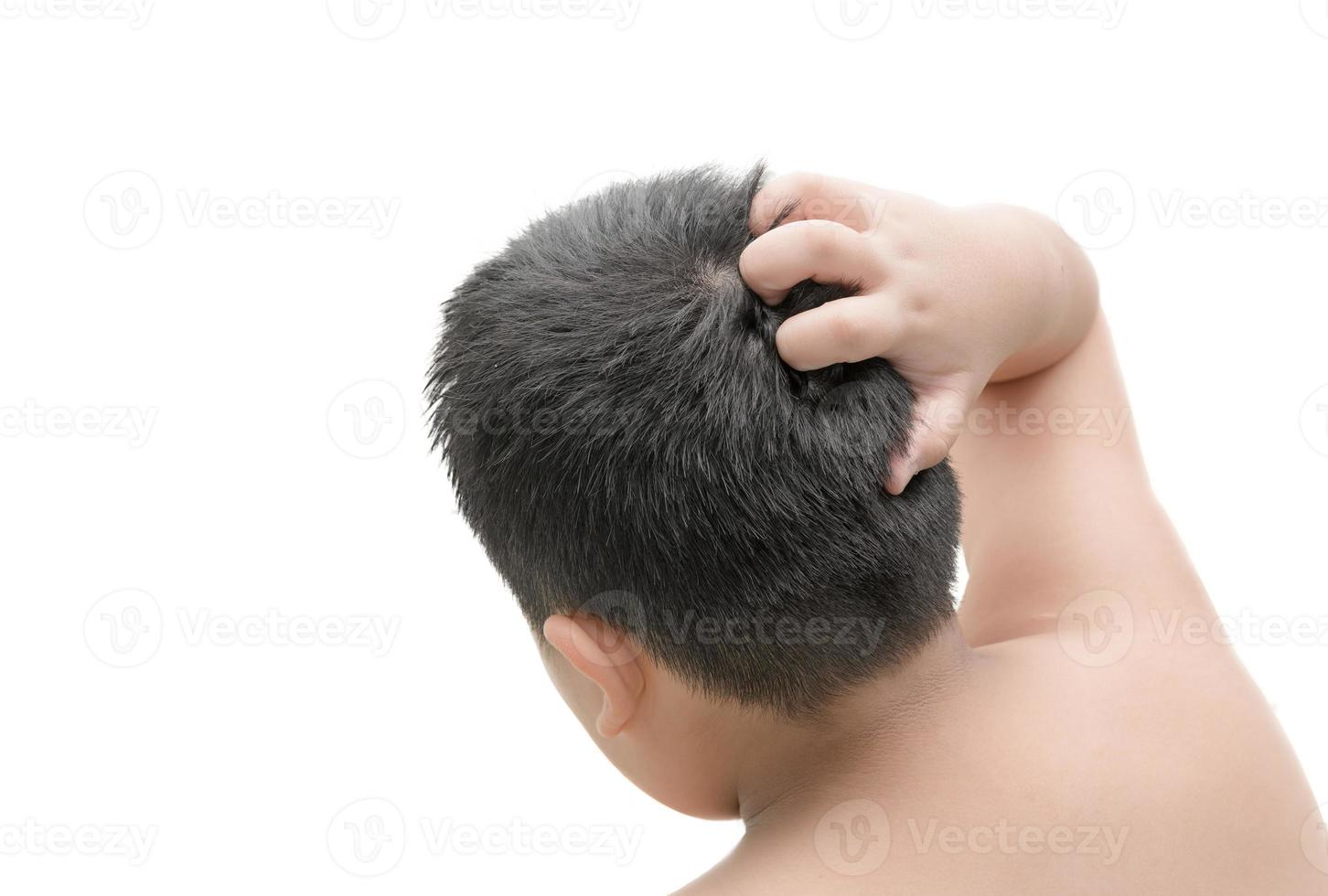 Closeup boy hand itchy scalp isolated on white photo