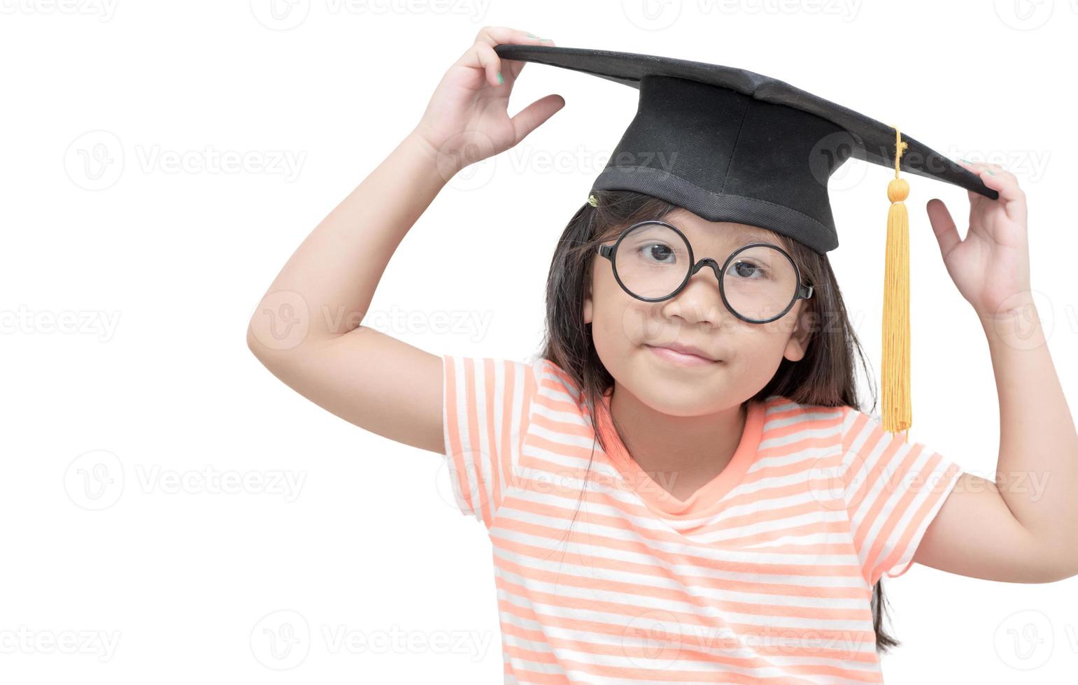 Happy Asian school kid graduate with graduation cap isolated photo