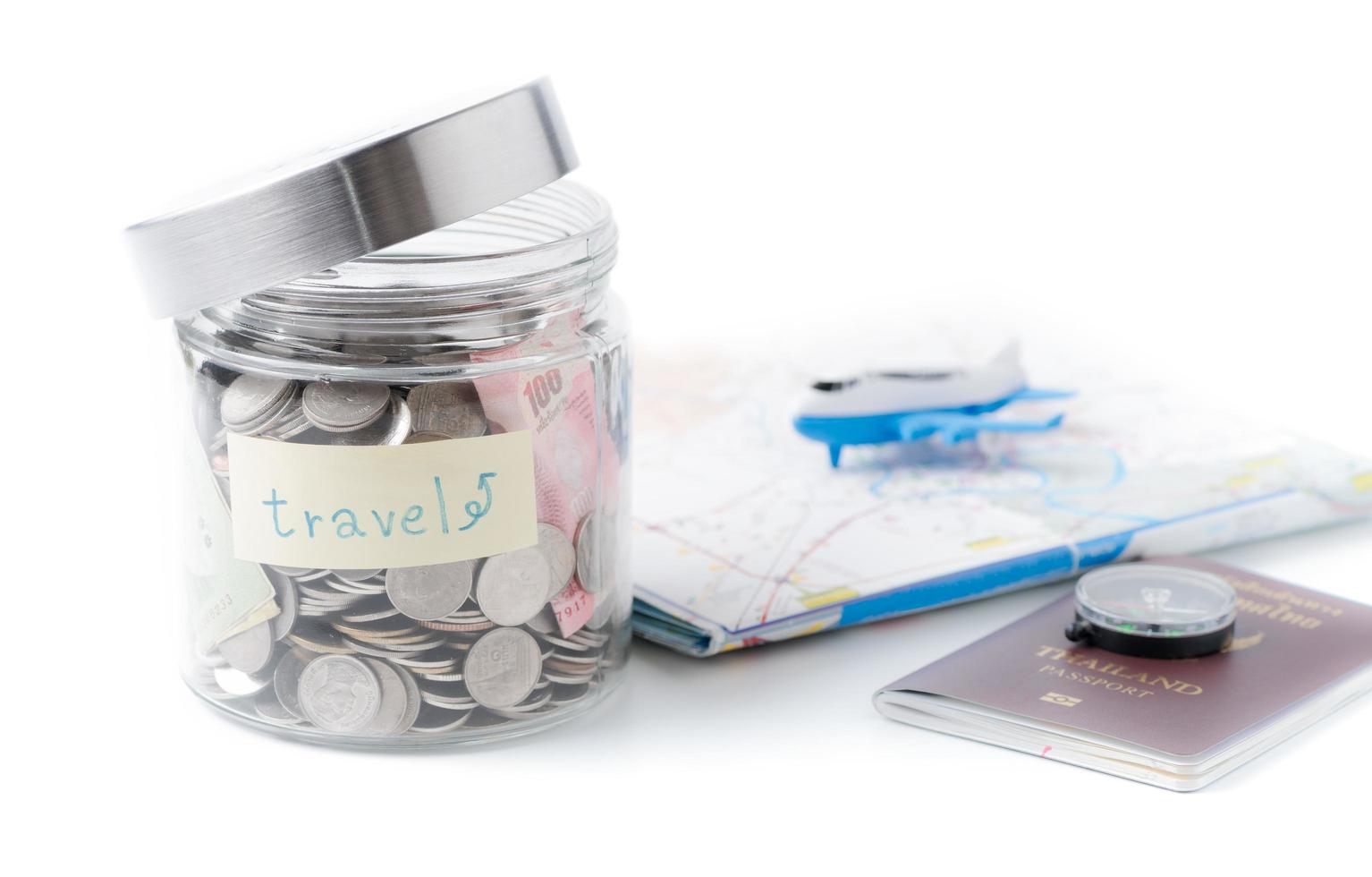 Travel budget concept. travel money savings in a glass jar. photo