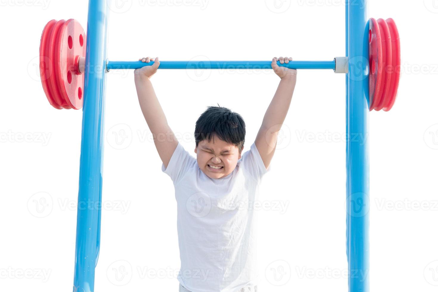 Isolated portrait of obese fat boy exercising weight lifting photo