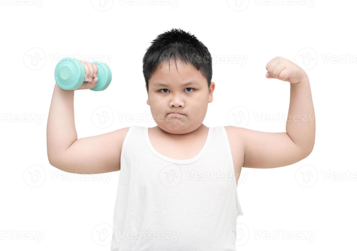 obese fat boy is doing exercises with dumbbells isolated photo