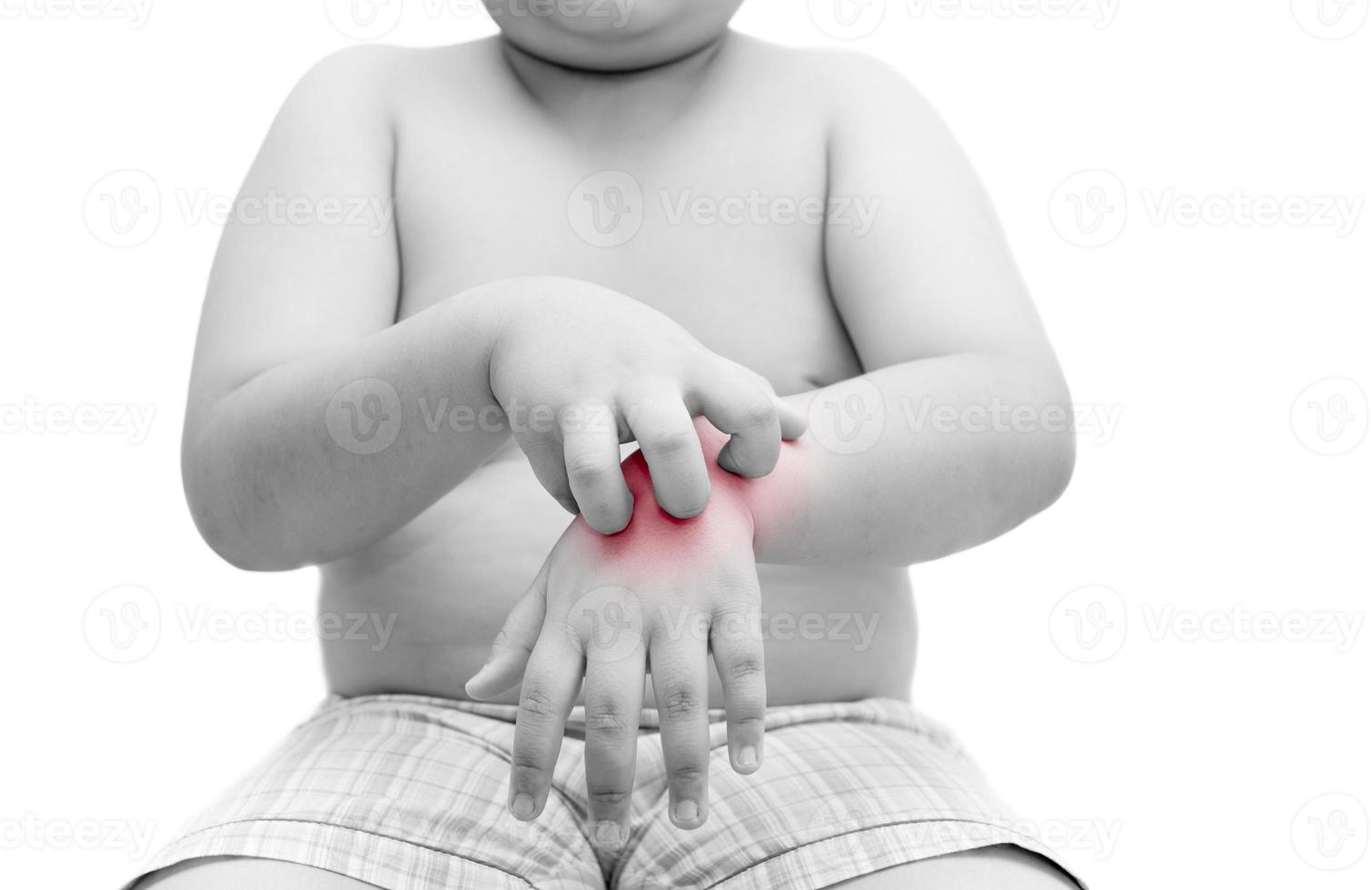obese fat boy scratch the itch with hand. itching isolated. photo