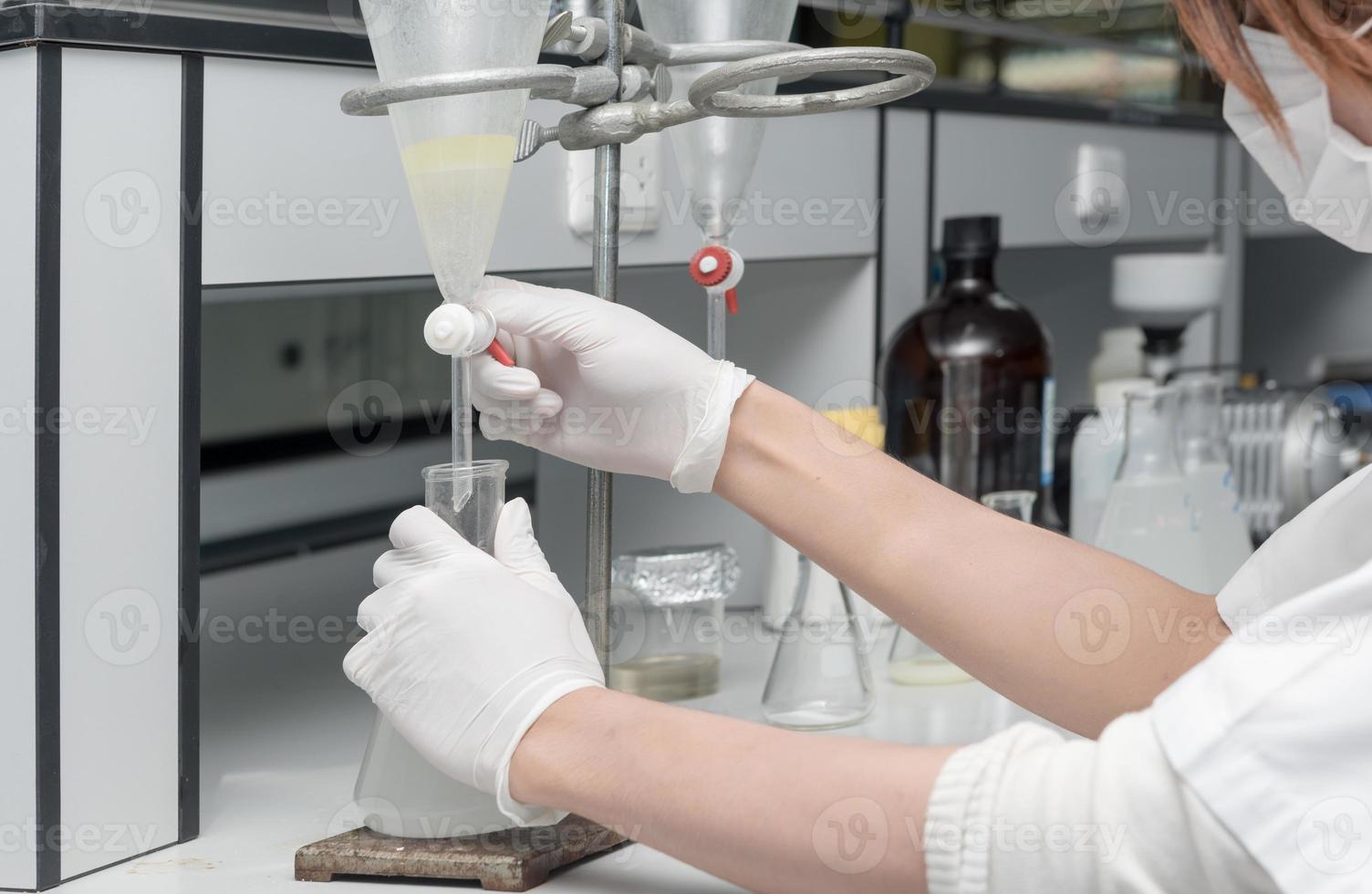 Scientist working in laboratory, testing samples photo