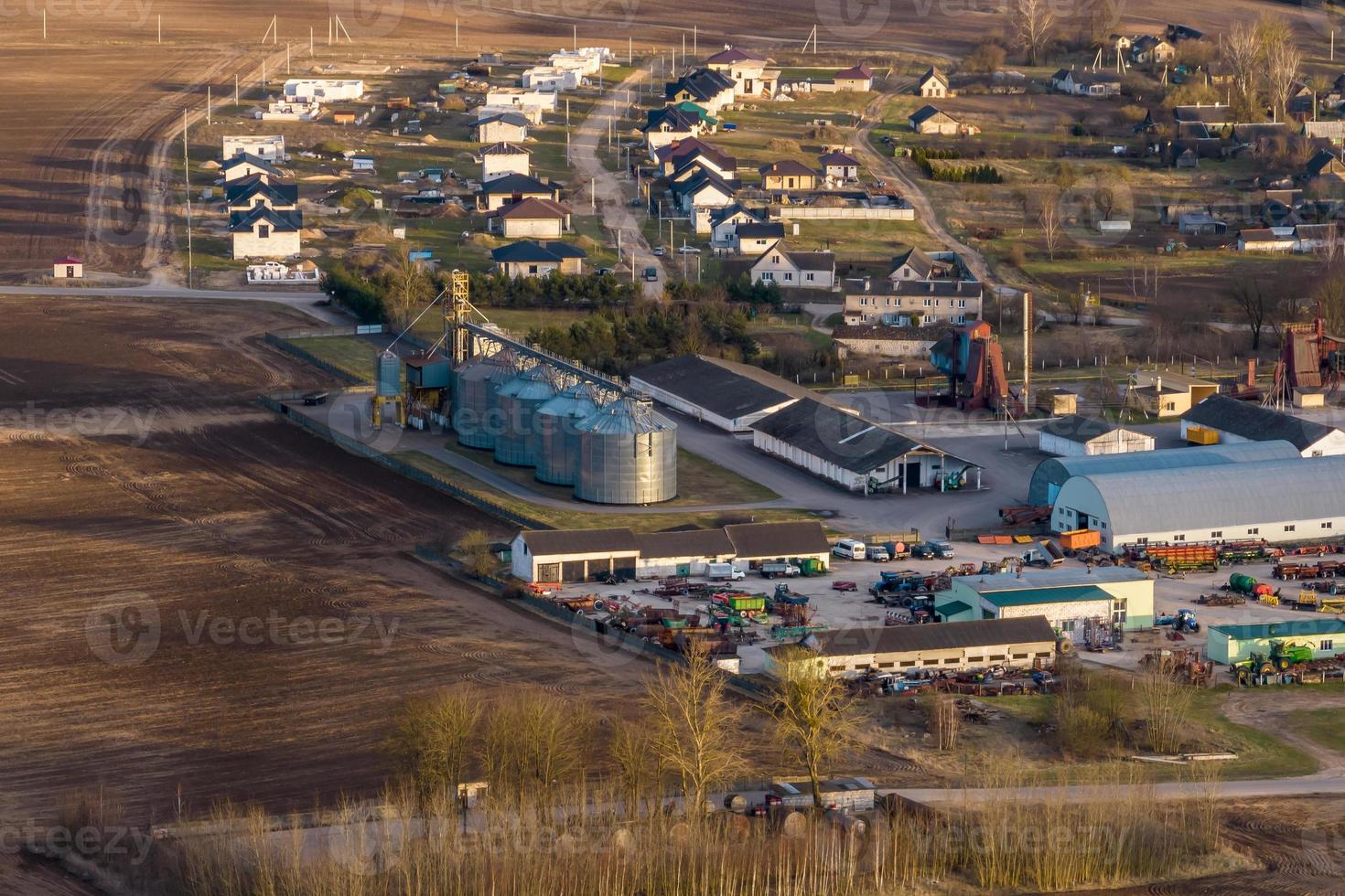 aerial panoramic view on agro-industrial complex with silos and grain drying line for drying cleaning and storage of agricultural products photo