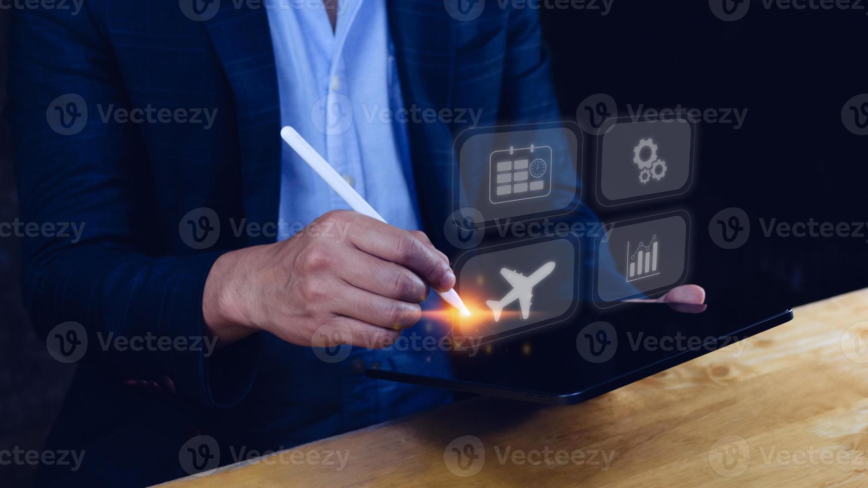 Businessman pointing finger touching to select flight by pressing touch screen airplane button,Business Airplane transportation concept photo