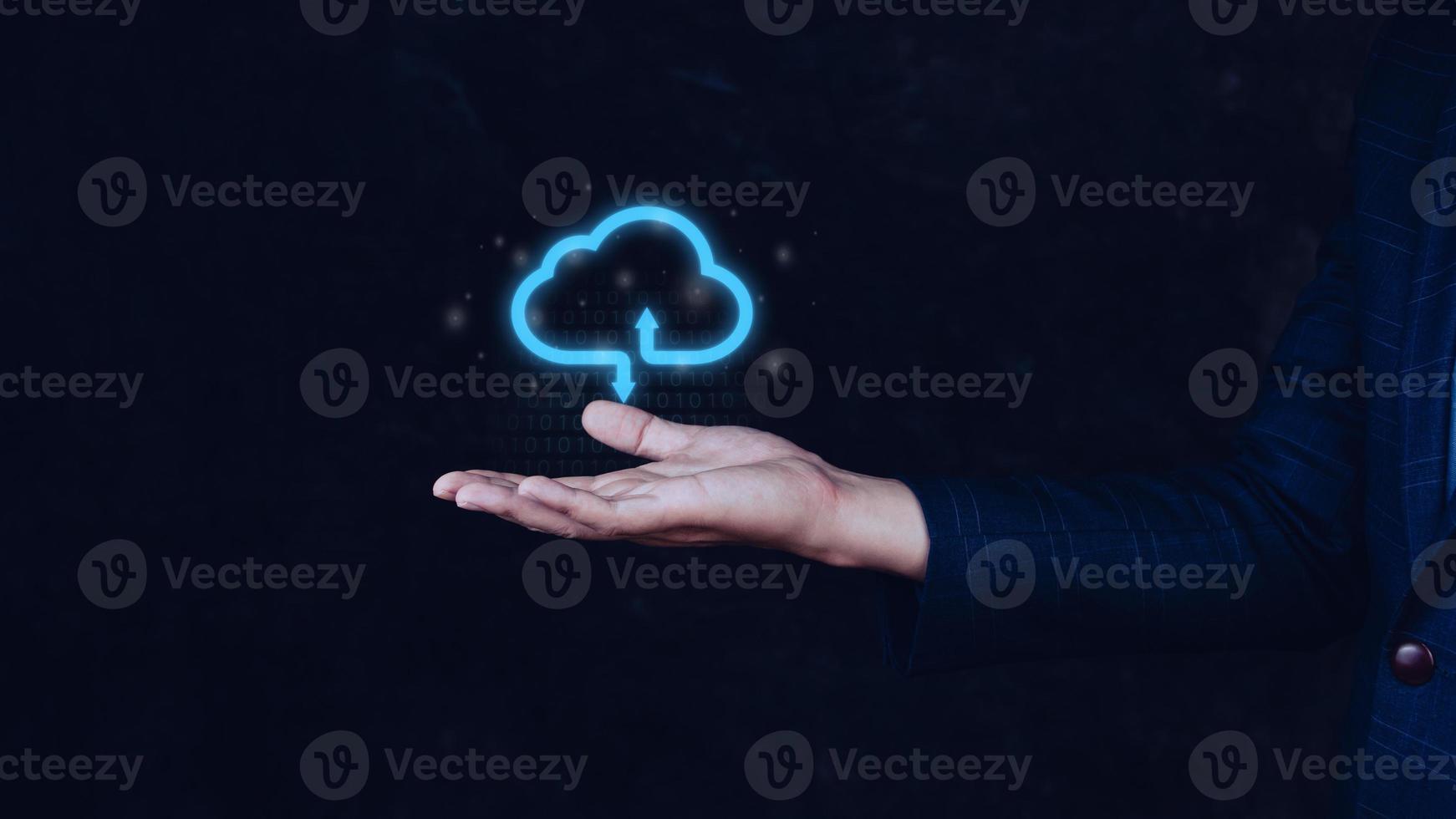Businessman holding and giving virtual cloud icon computing with copy space to transfer data information and upload download application. technology transformation concept.Big data Concept photo