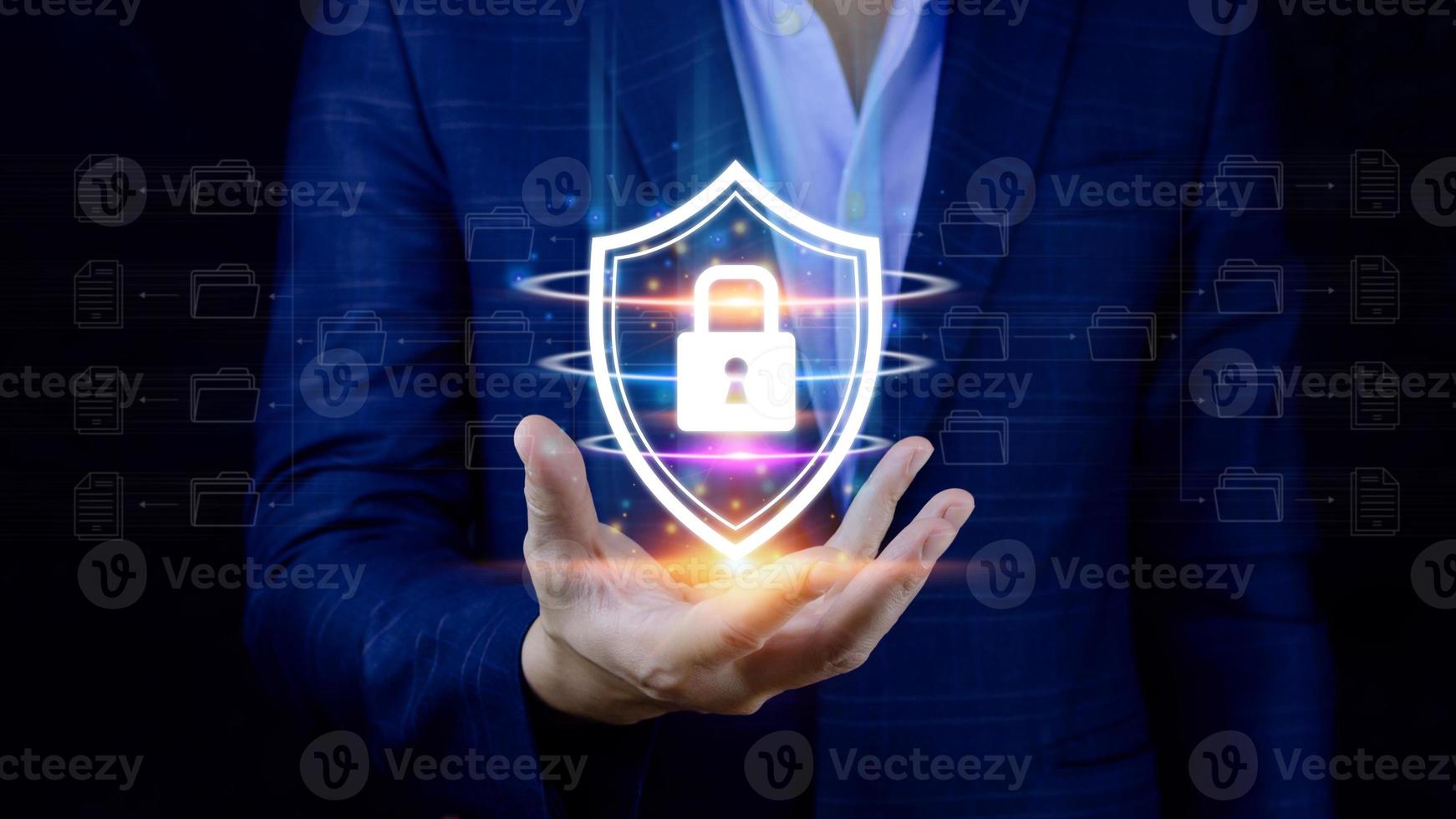 Computer network protection, secure and safe your data concept, businessman holding shield protection icon, Security shield Lock Security Businessman Protect Concept photo