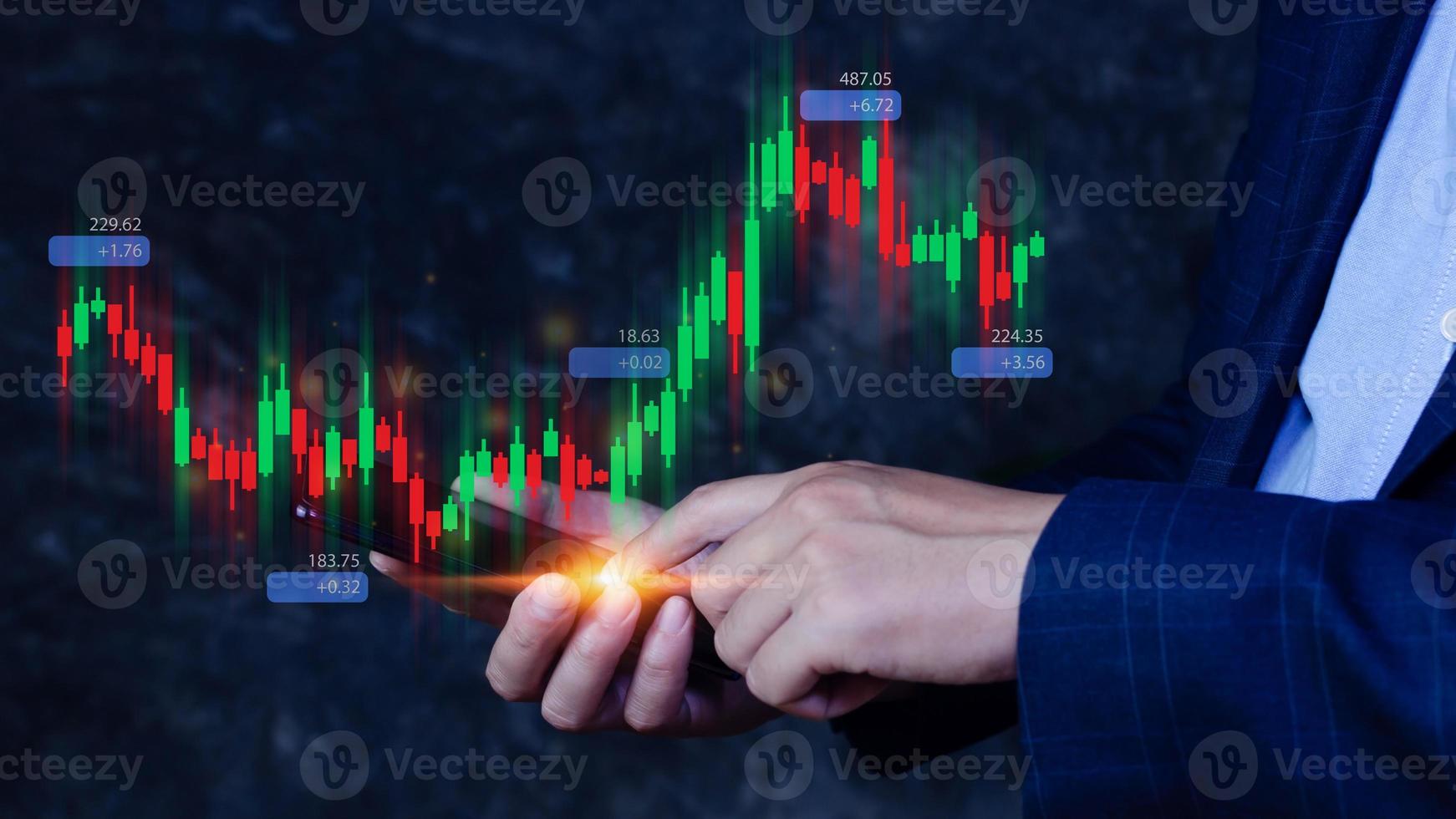 Hand of businessman or trader is showing growing virtual hologram stock on smartphone, planning and strategy, Stock market, Business growth, progress or success concept. invest in trading. photo