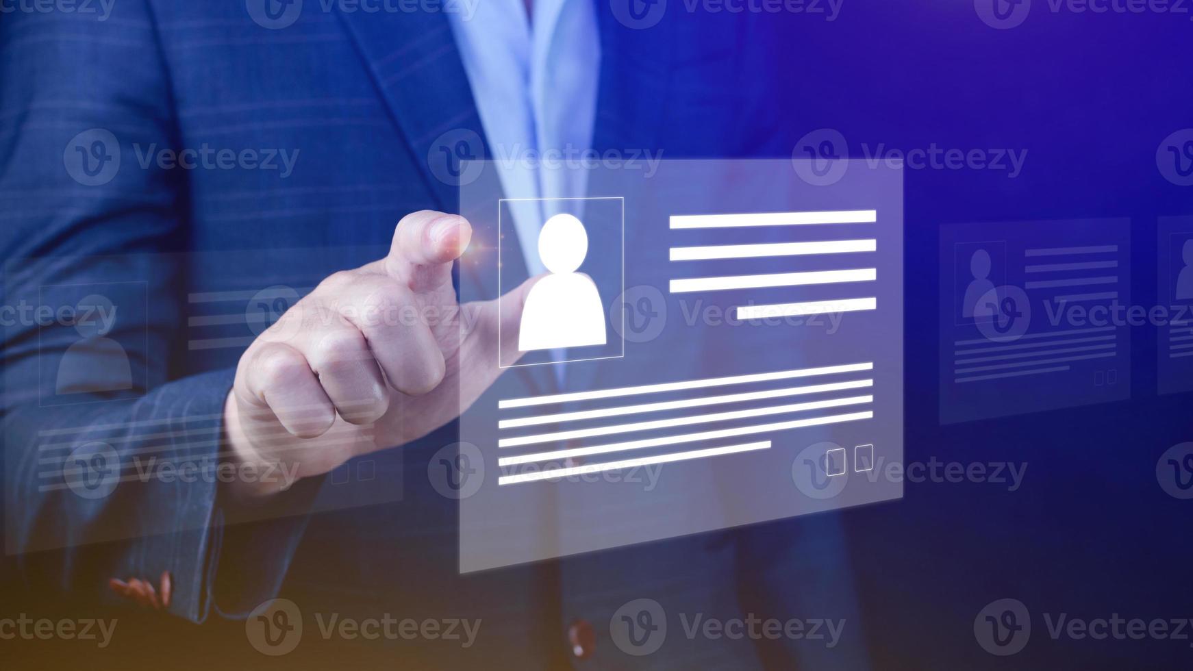 Human resources manager choosing professional profile to hire on virtual screen interface, recruitment concept. Businessman hand pointing icon resource HR management concept photo