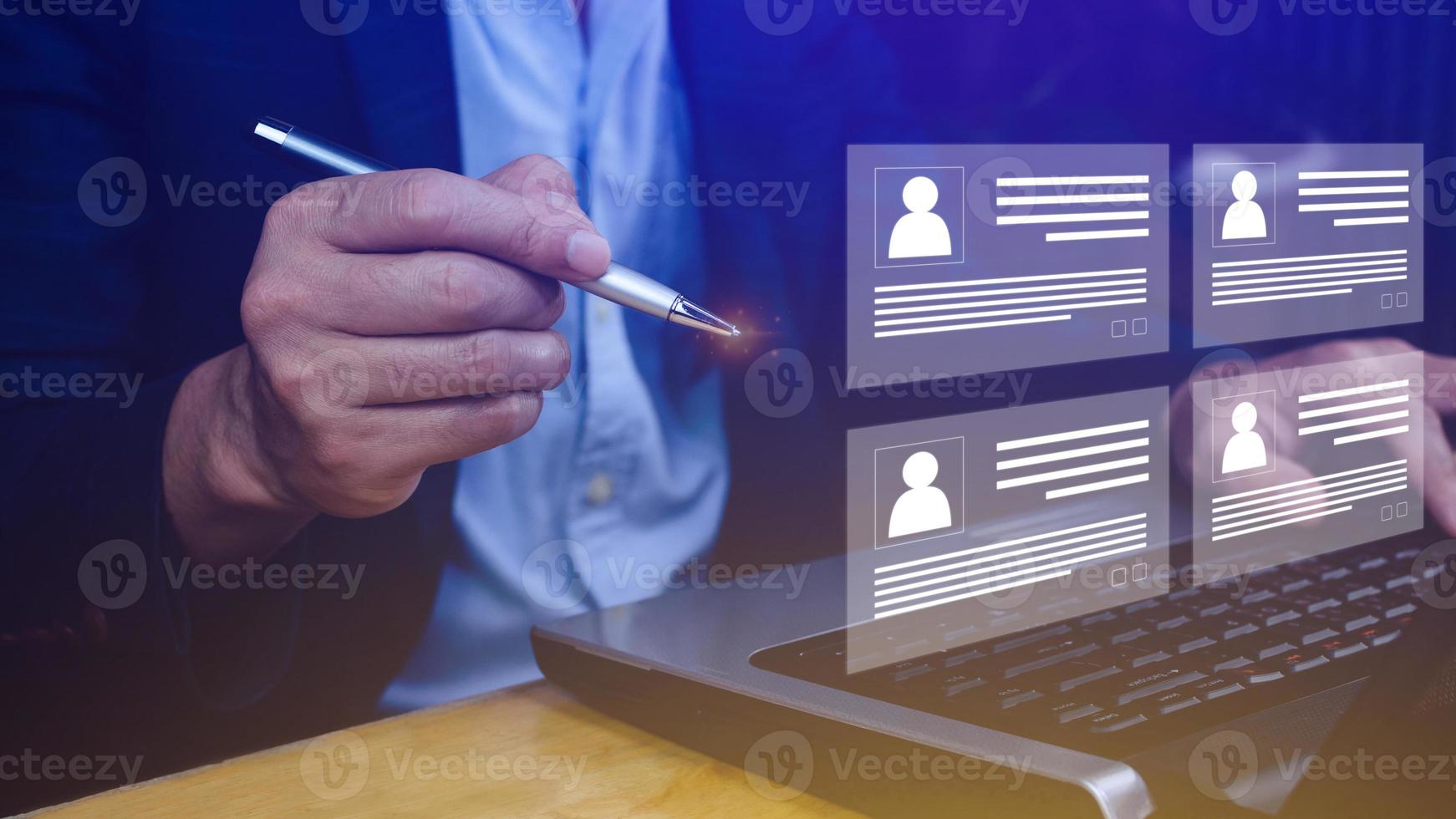 Human resources manager choosing professional profile to hire on virtual screen interface, recruitment concept. Businessman hand pointing icon resource HR management concept photo