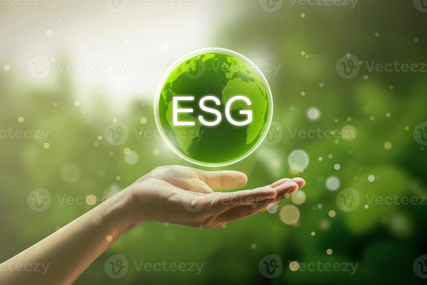 asian man hand with ESG icon global sustainability concept. Environment, society and governance sustainability business background. photo