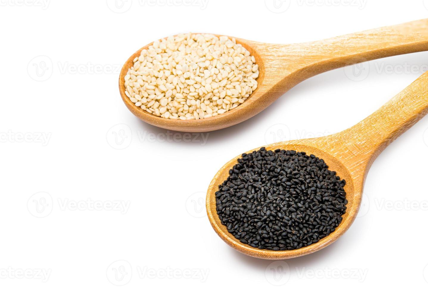 white and black sesame seeds with spoon isolated on white background. organic natural sesame seeds with spoon on background. toasted sesame seeds with spoon on white background photo
