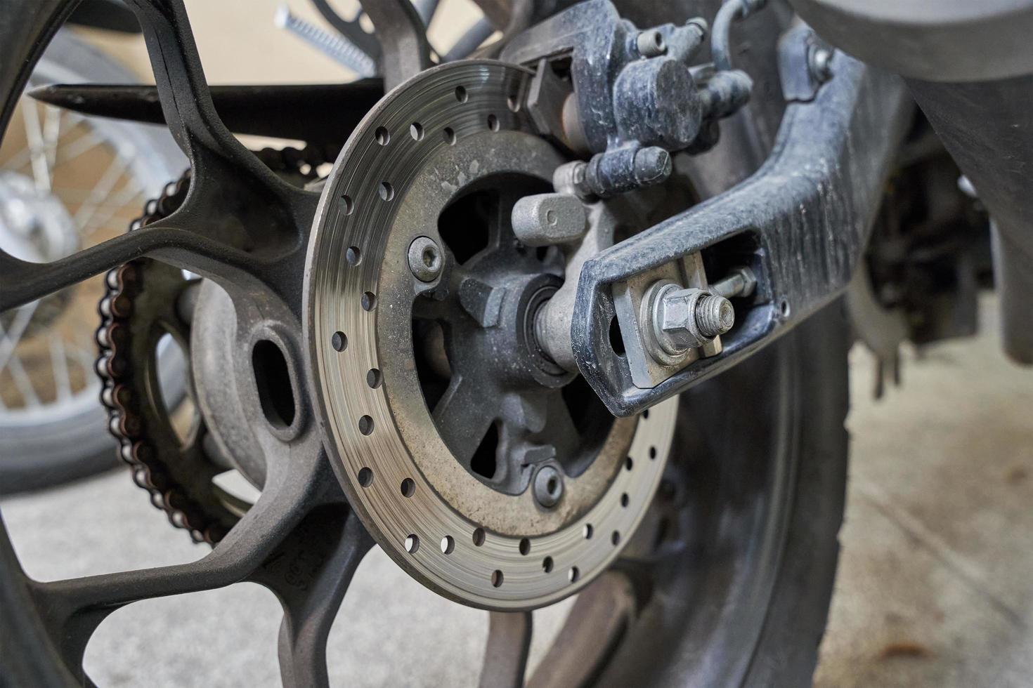 close up motorcycle brake and wheel. motorbike brake and wheel. motor, chain rotor photo