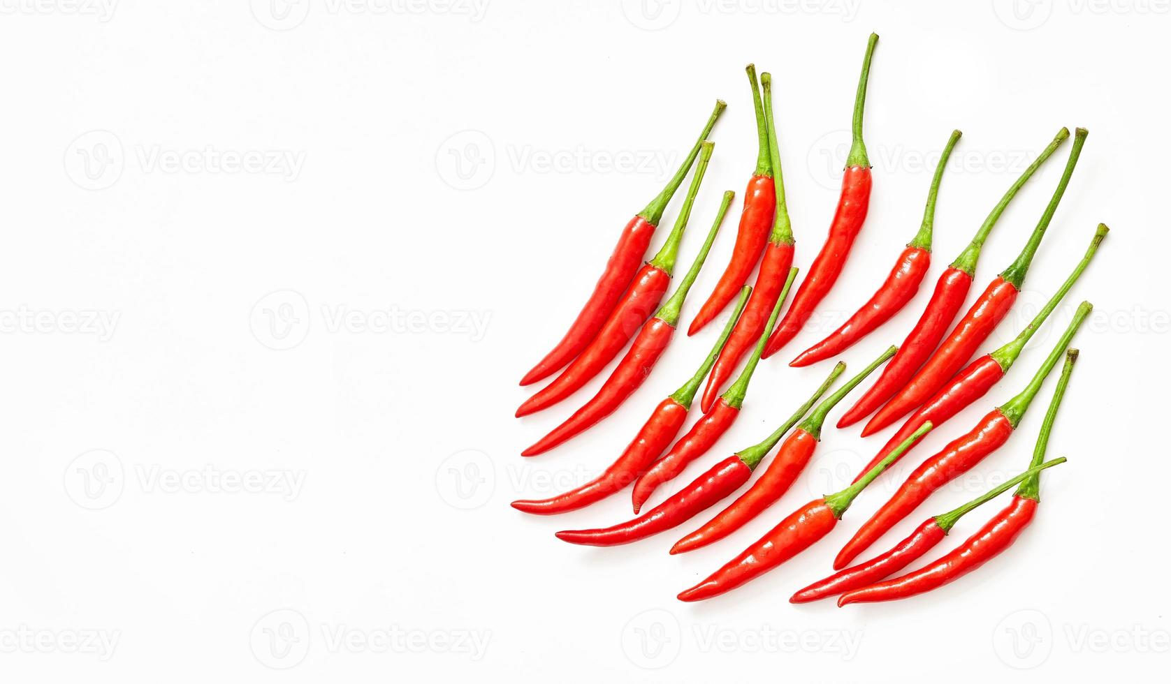 top view or flat lay group of red chili pepper isolated on white overhead background. photo