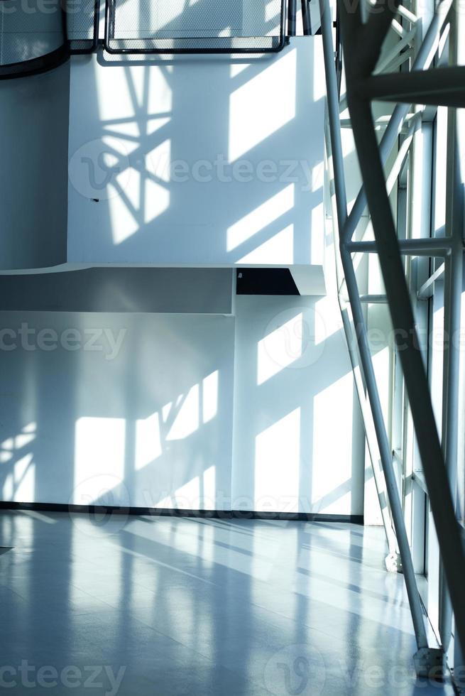 shadow and light reflection inside the building view and moving escalator photo