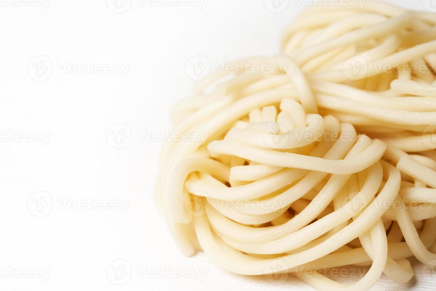close up ramen or soba noodles on white background with copy space photo