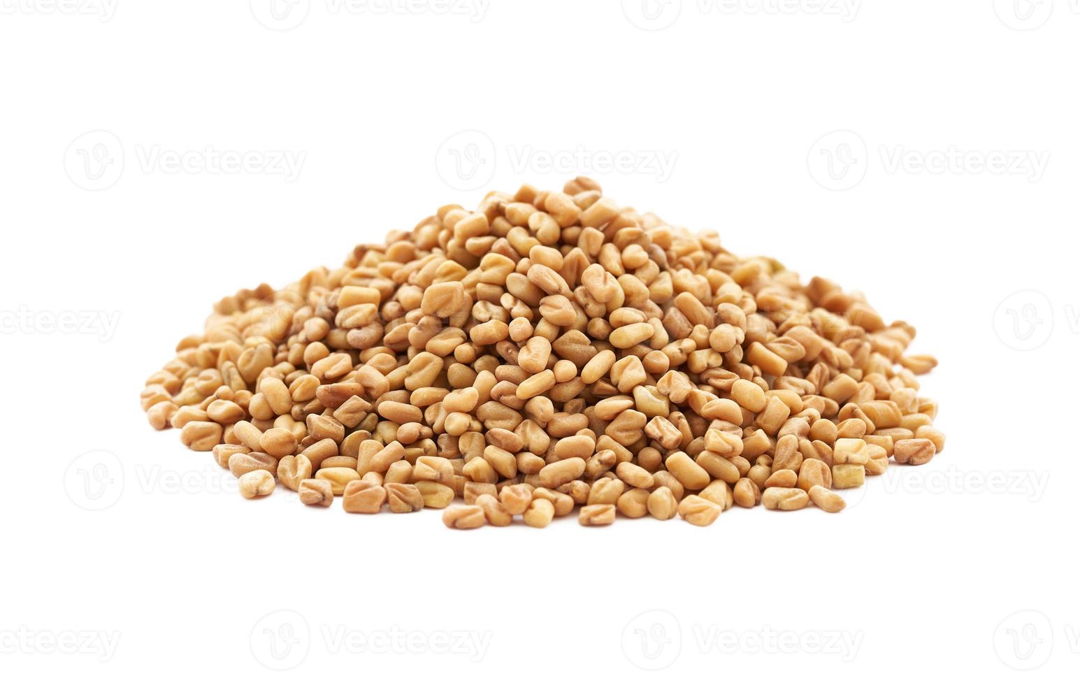 a pile of fenugreek seed isolated on white background. fenugreek isolated photo