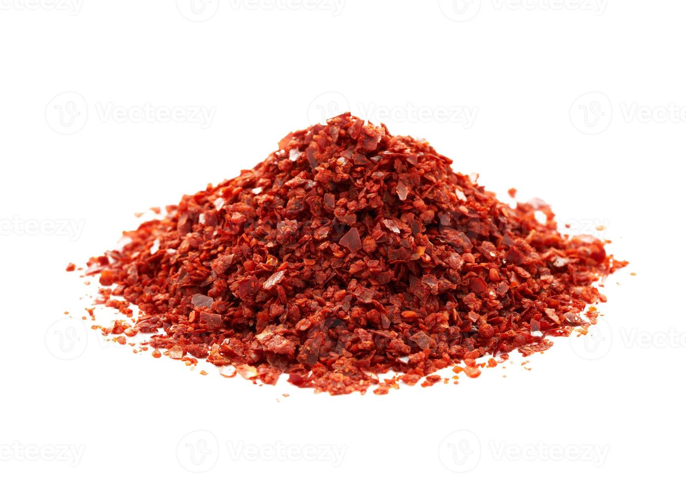 a pile of red pepper flake or heap of red pepper powder coarse. korean chili ground Gochugaru isolated on white background photo