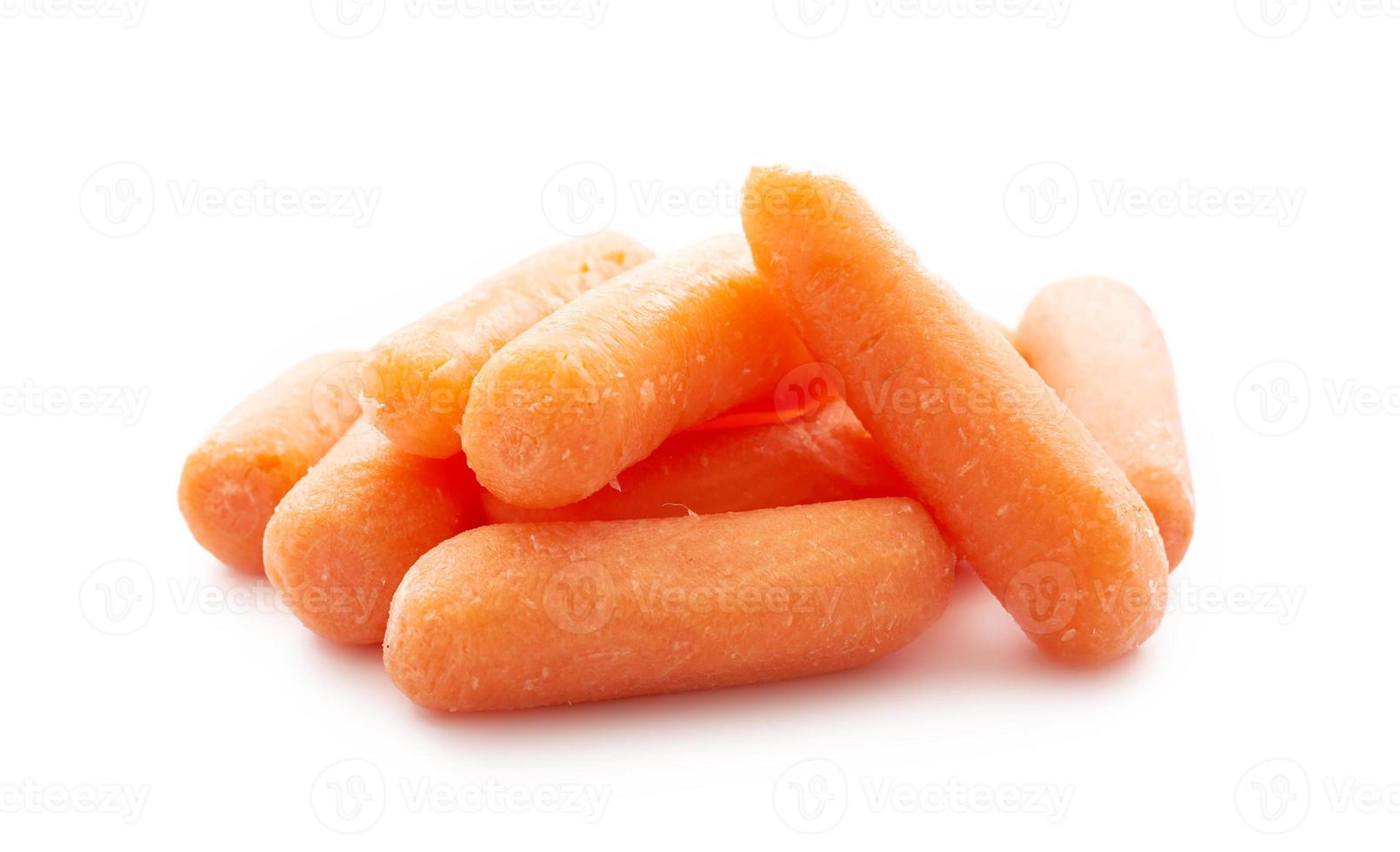 close up pile of baby small carrots isolated on white background. small baby carrots, fresh baby carrots photo