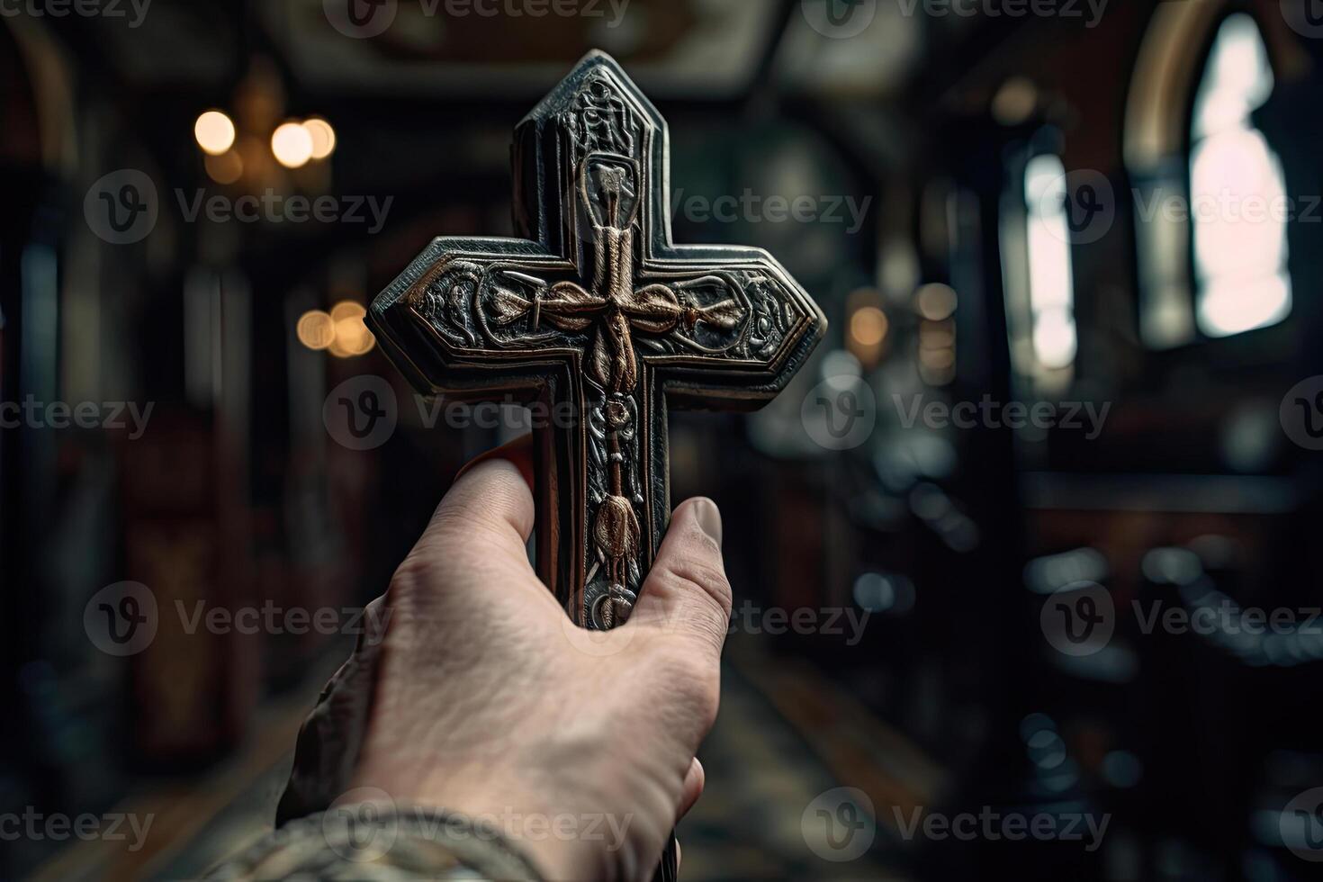 Church priest holds religious cross in hands. photo