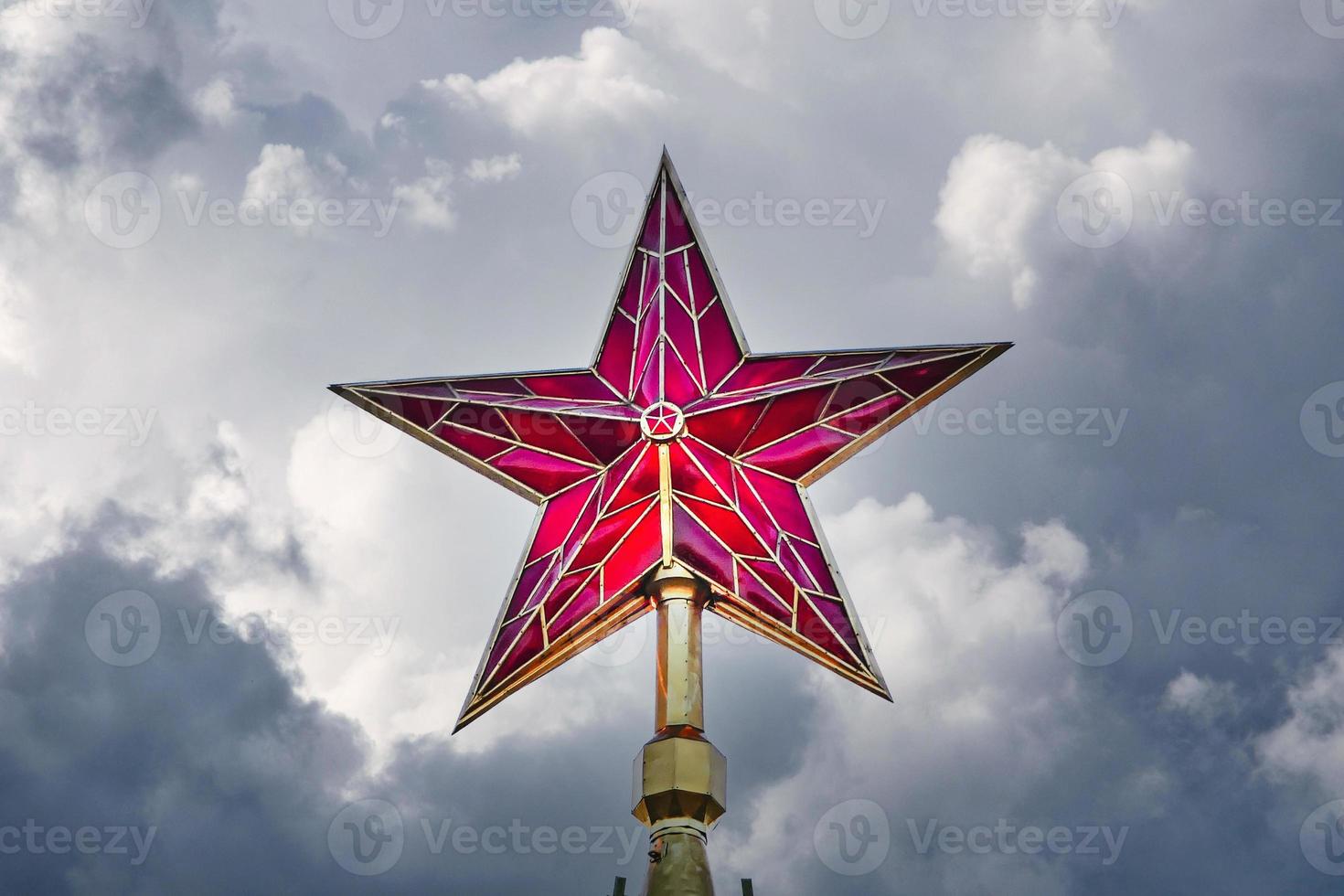 Moscow Kremlin red ruby star in the dark stormy sky photo