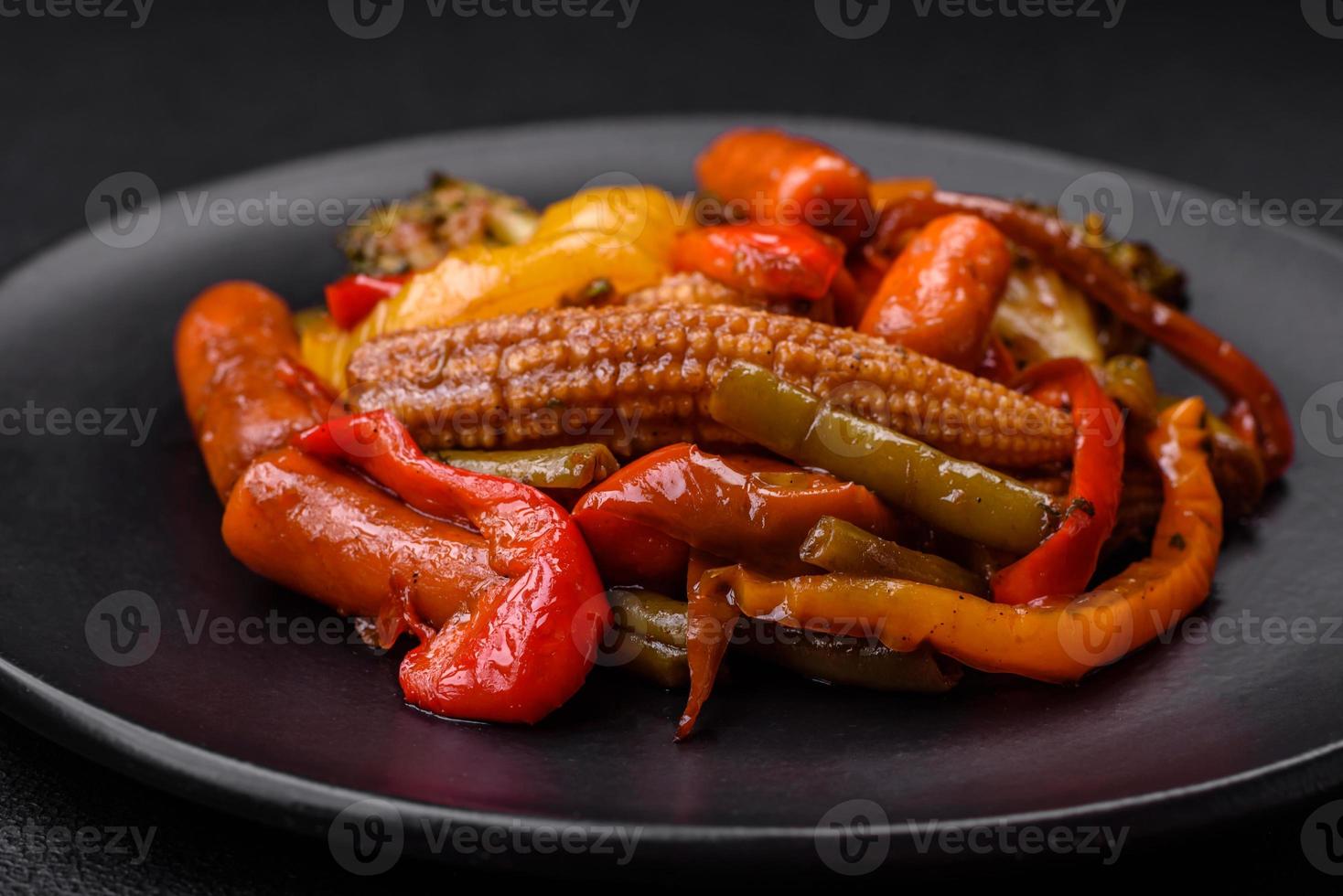 Mix of vegetables corn, carrots, peppers, broccoli, onions in teriyaki sauce photo
