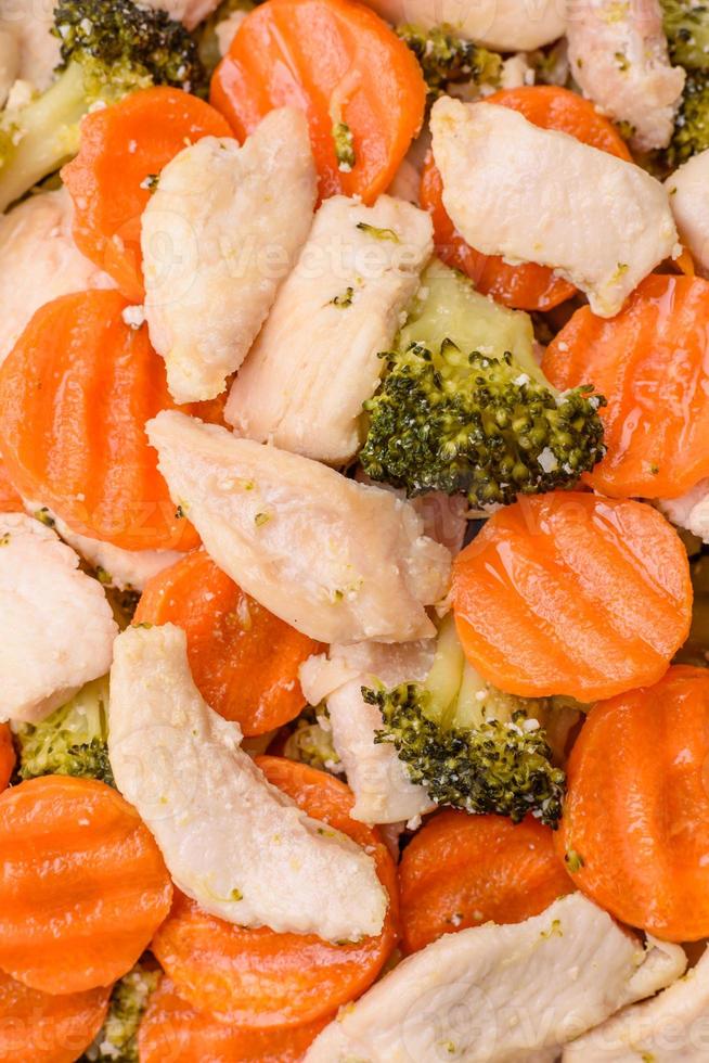 Delicious dish consisting of pieces of boiled chicken, broccoli and carrots photo