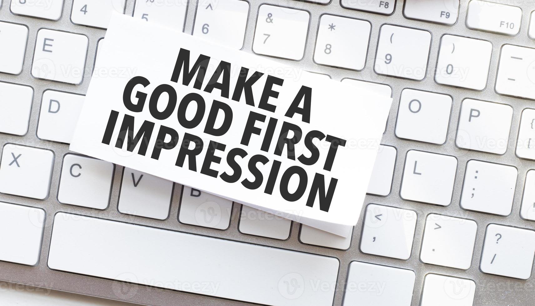 Text Make a good first impression written on paper sheet on a computer keyboard photo