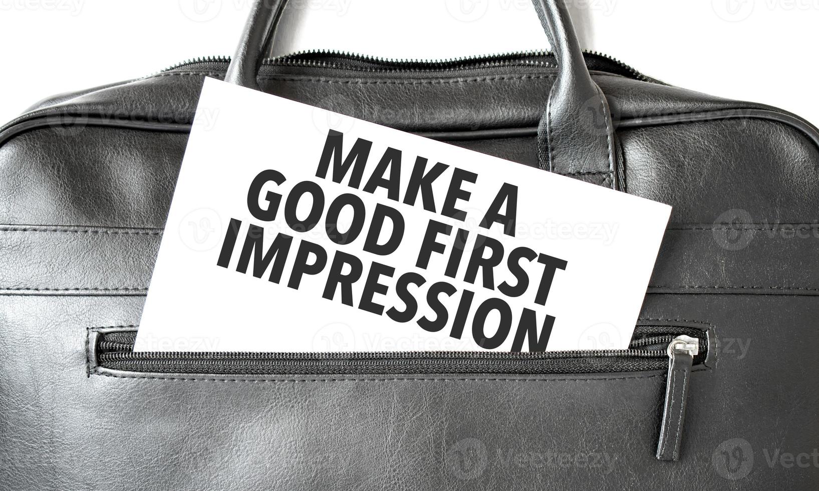 Text Make a good first impression writing on white paper sheet in the black business bag. Business concept photo