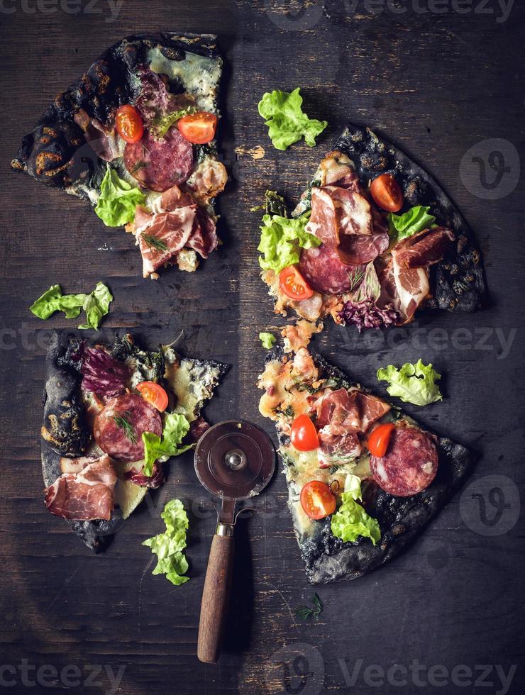 Black pizza slices photo