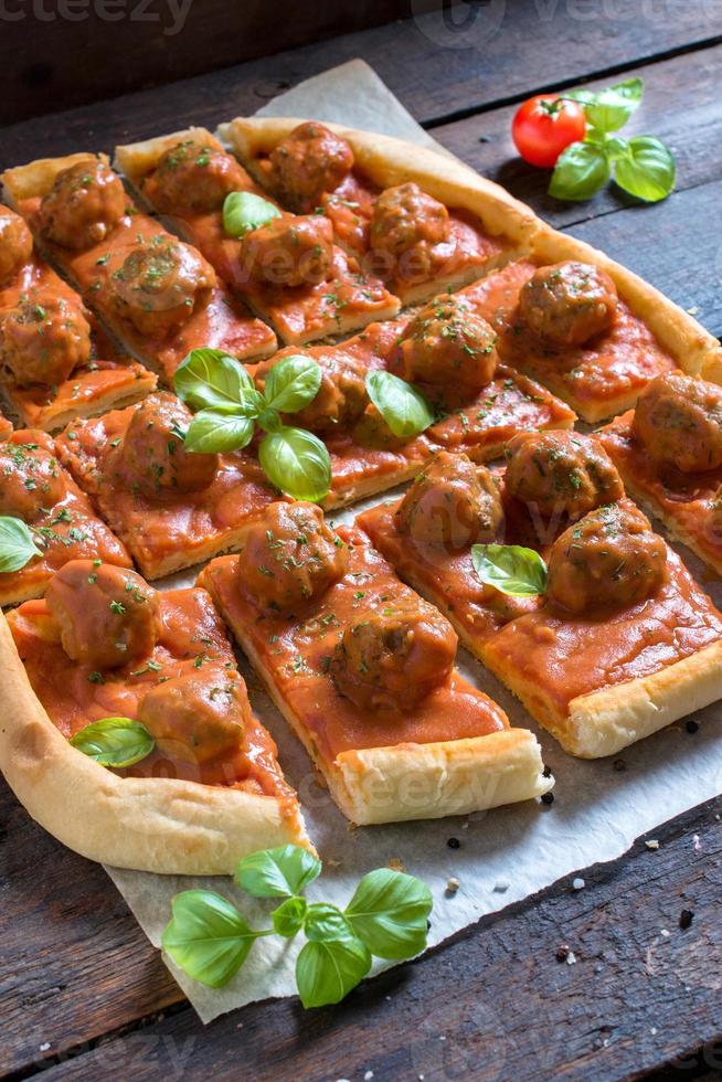 Sliced meatballs pizza photo