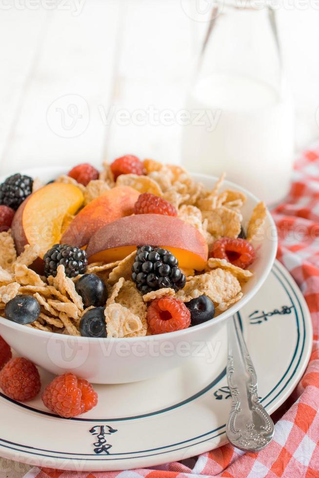 Corn flakes and berry fruits photo