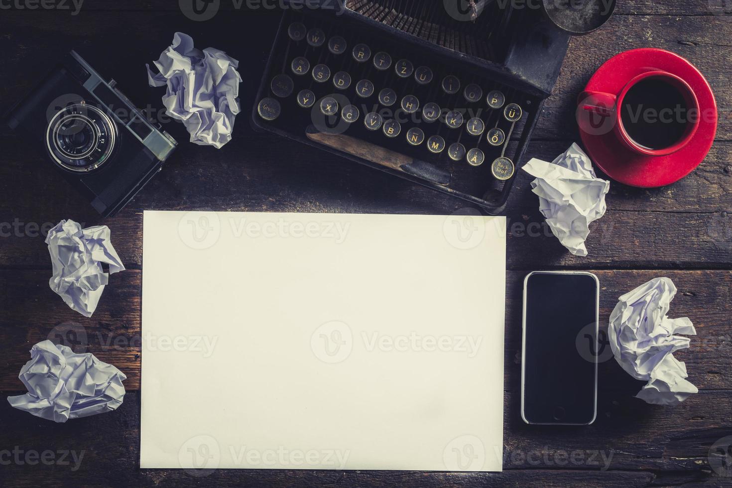 Blank white paper on the wooden table photo