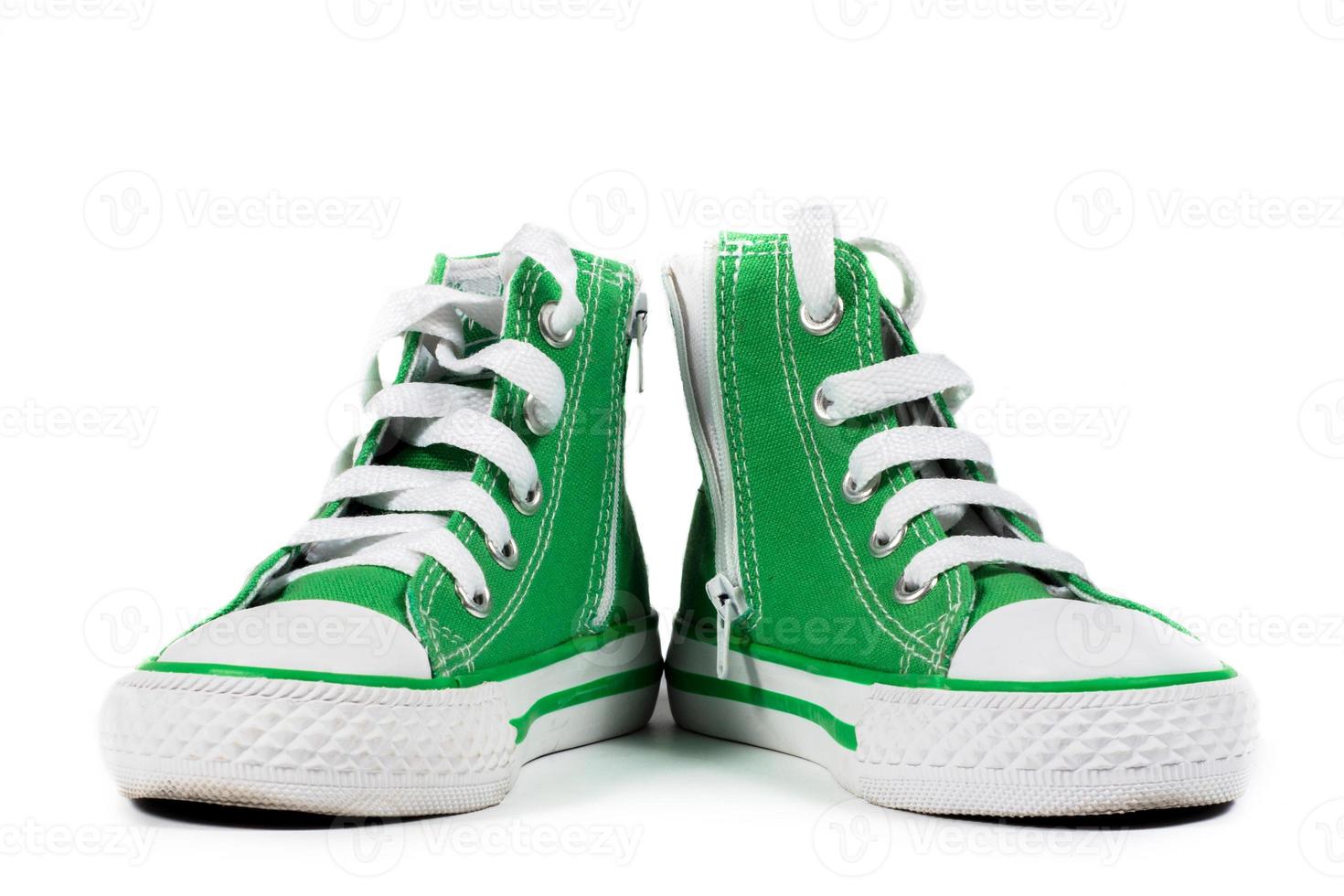 Pair of fashionable sneakers isolated photo