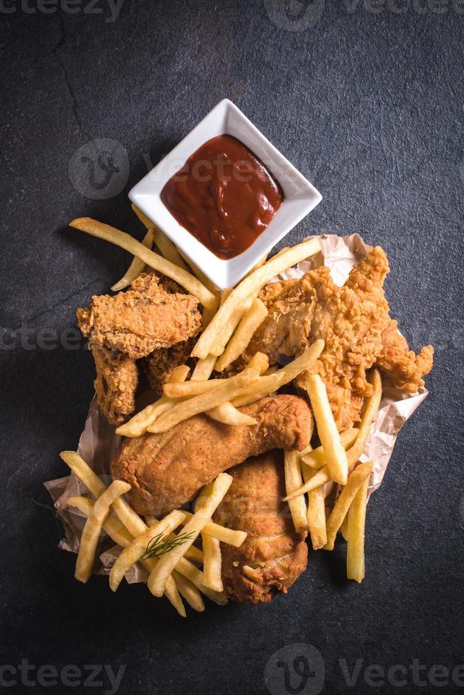 Chicken meat and french fries photo