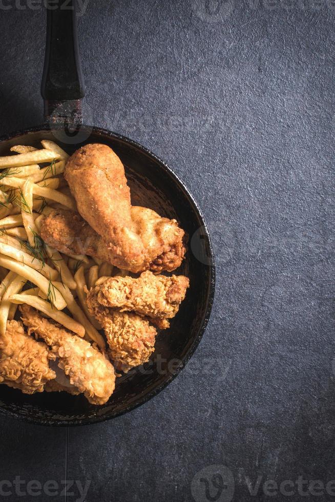 Fried chicken and French fries photo