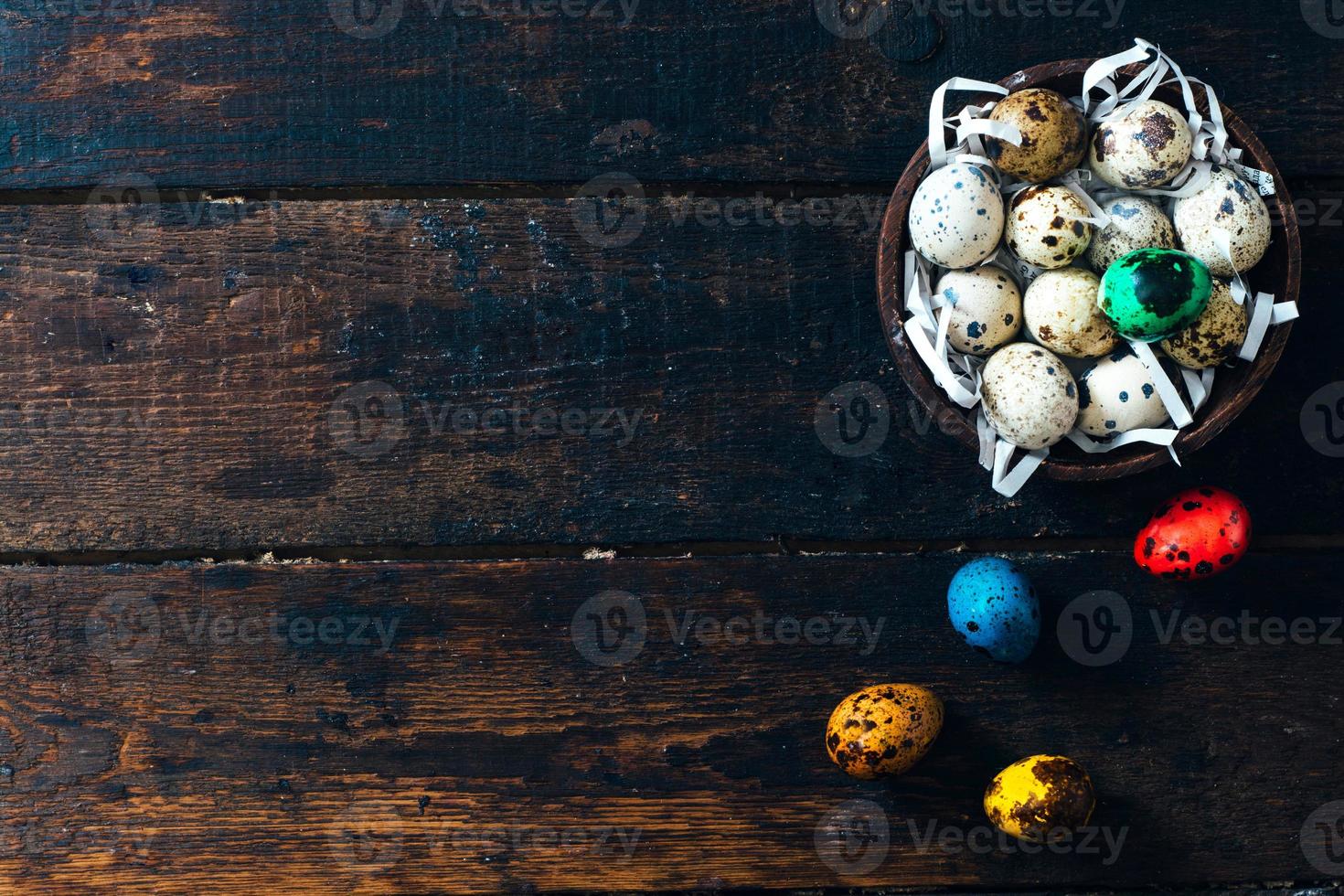 Easter eggs in wooden bowl photo