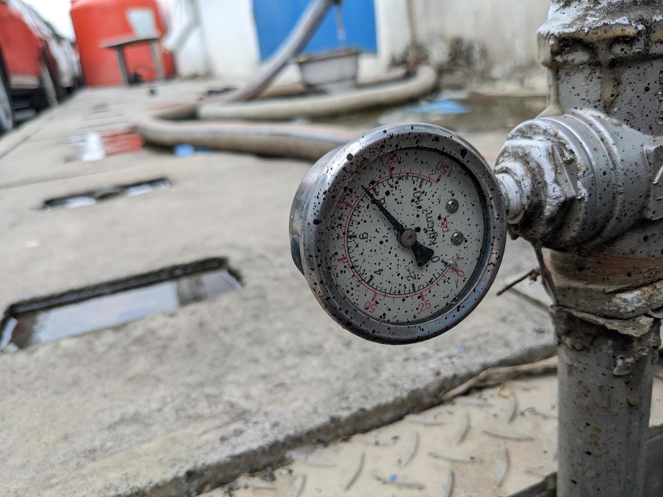 Pressure gauge of pressure sustaining valve for service air on power plant project. The photo is suitable to use for industry background photography, power plant poster and electricity content media.