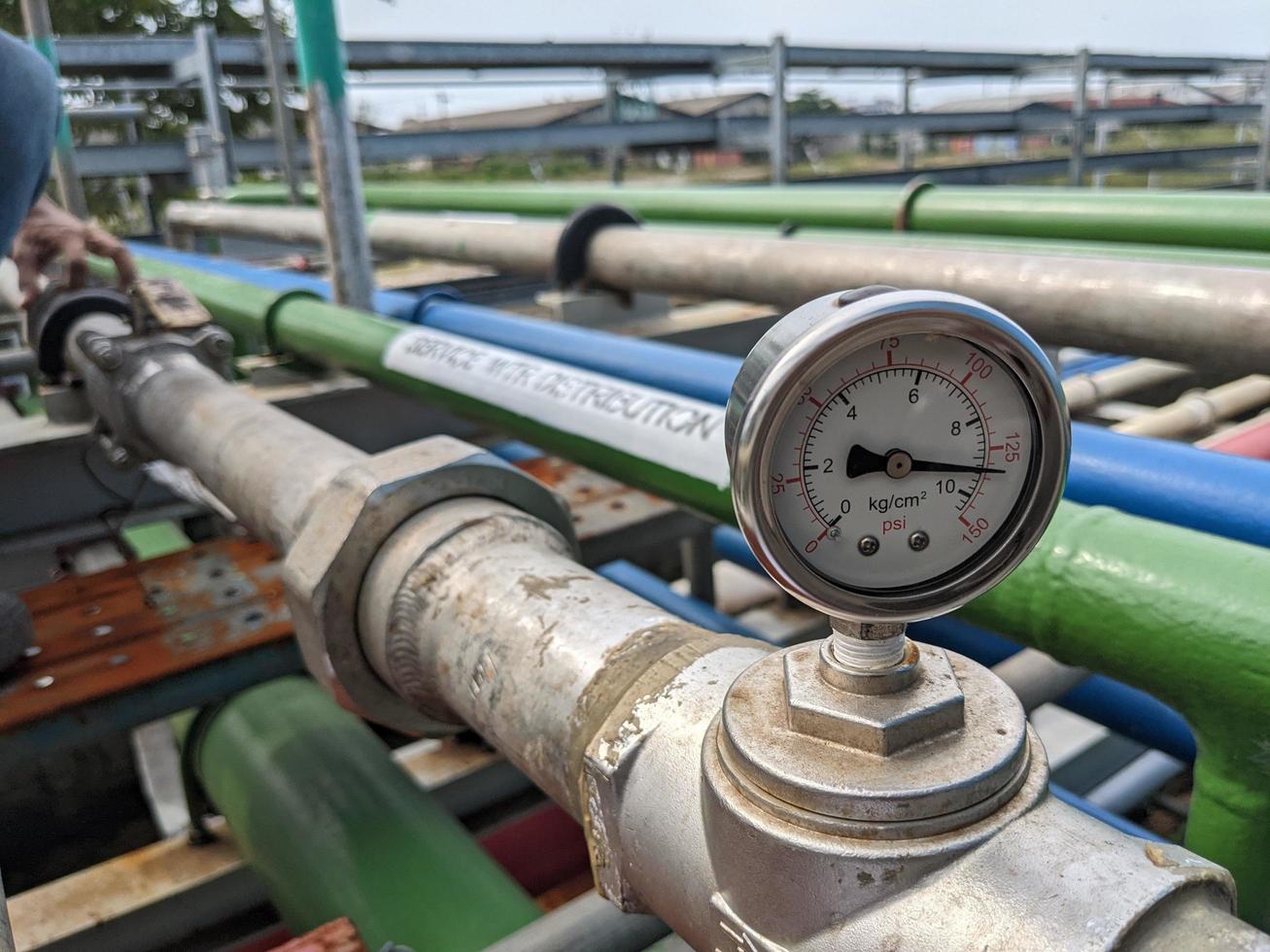 Pressure gauge of pressure sustaining valve for service air on power plant project. The photo is suitable to use for industry background photography, power plant poster and electricity content media.