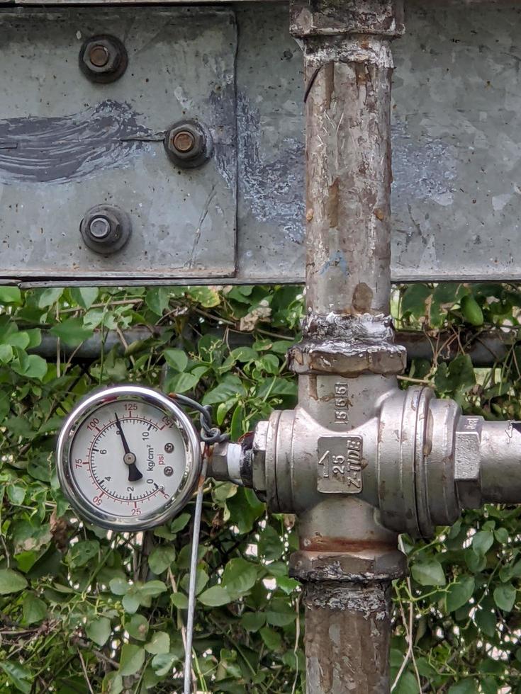 Pressure gauge of pressure sustaining valve for service air on power plant project. The photo is suitable to use for industry background photography, power plant poster and electricity content media.