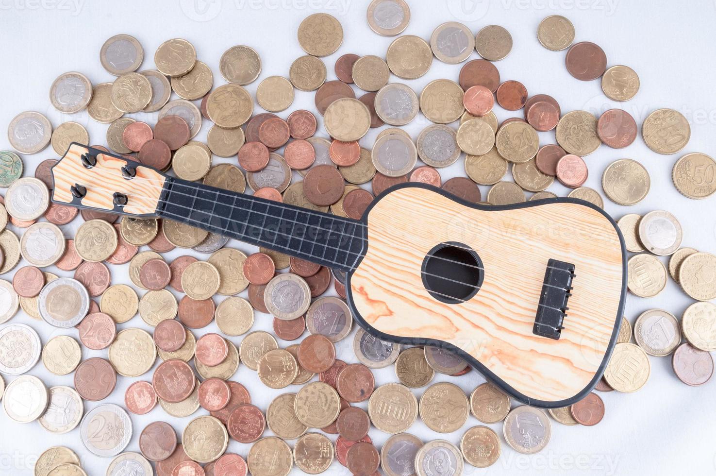 Coins and a guitar photo