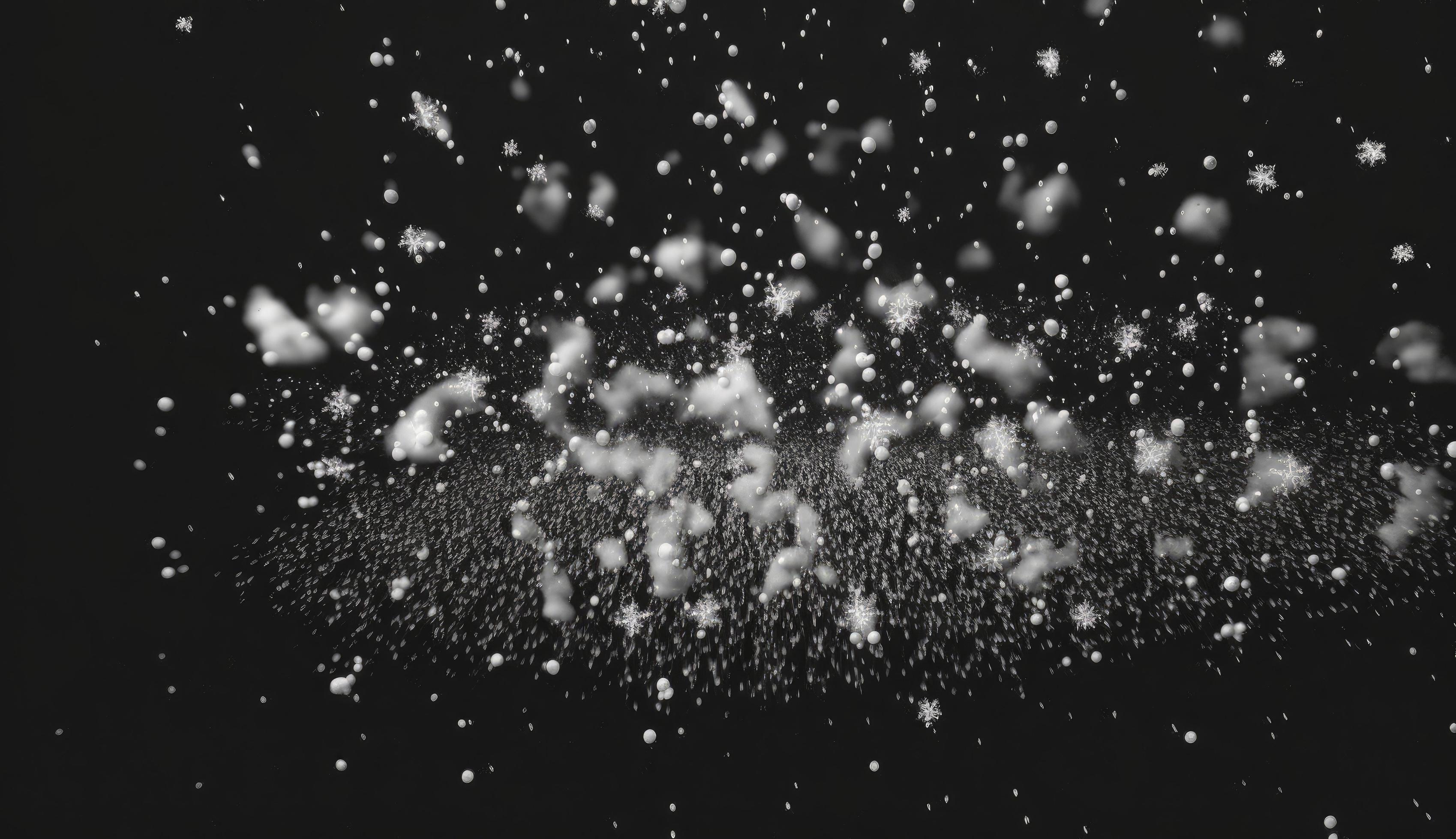 Snowflakes falling down on black background, heavy snow flakes